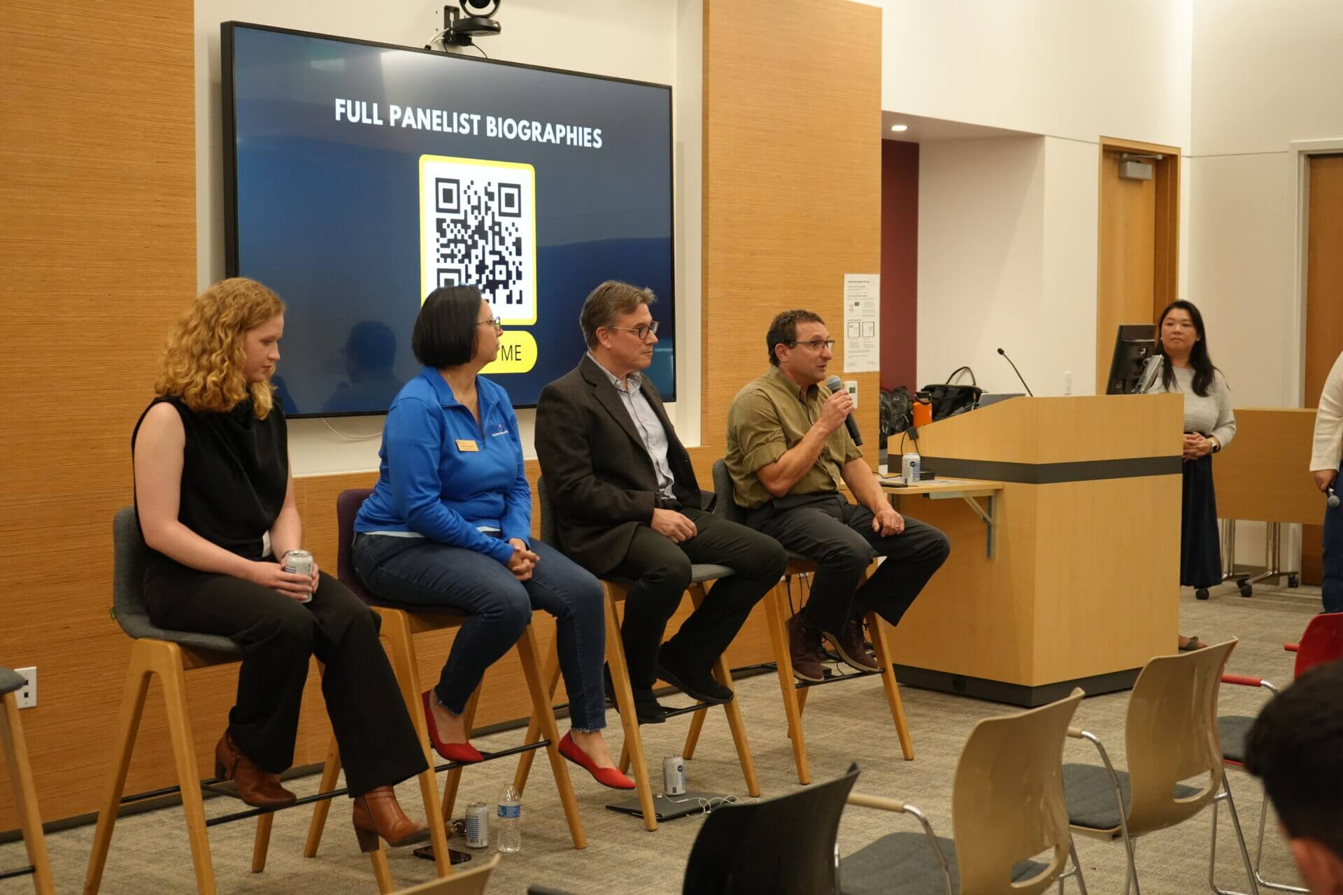 Four Speakers at a stage speaking on an MFD event