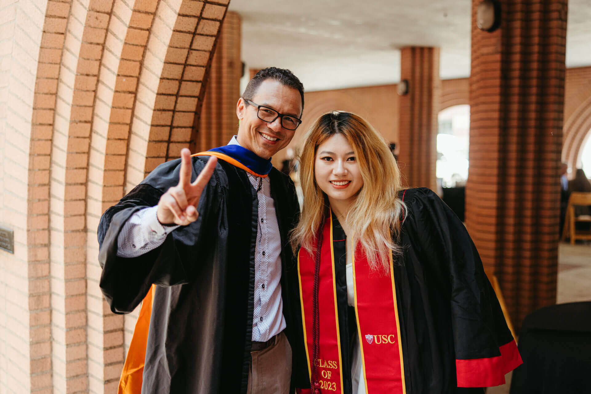 Two people from MFD getting their picture clicked at graduation ceremony